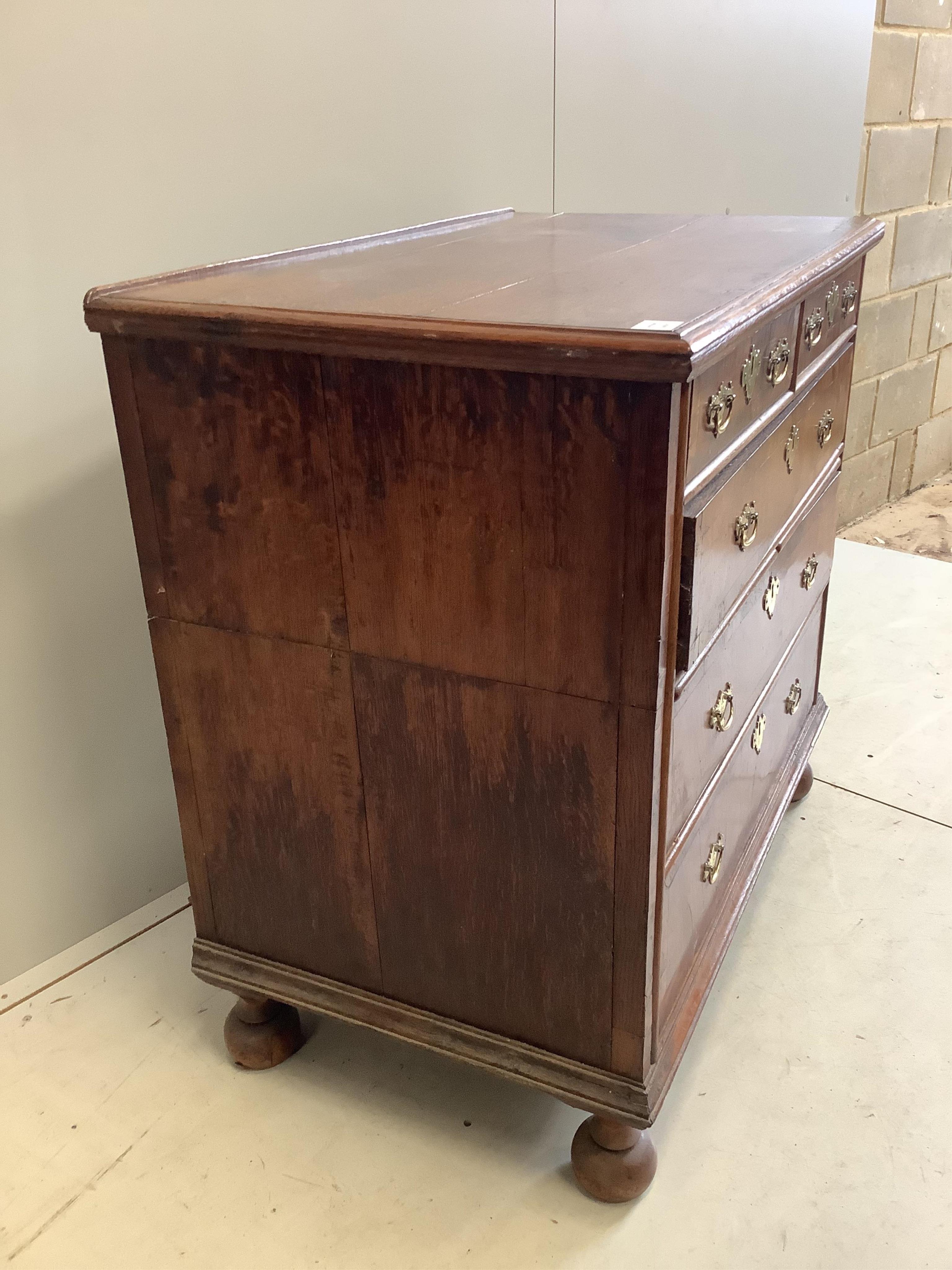 An early 18th century oak and walnut chest, in two sections, width 98cm, depth 58cm, height 93cm. Condition - fair